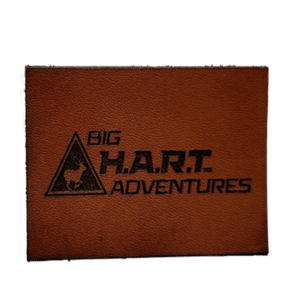 square leather patch with big H.A.R.T adventures logo